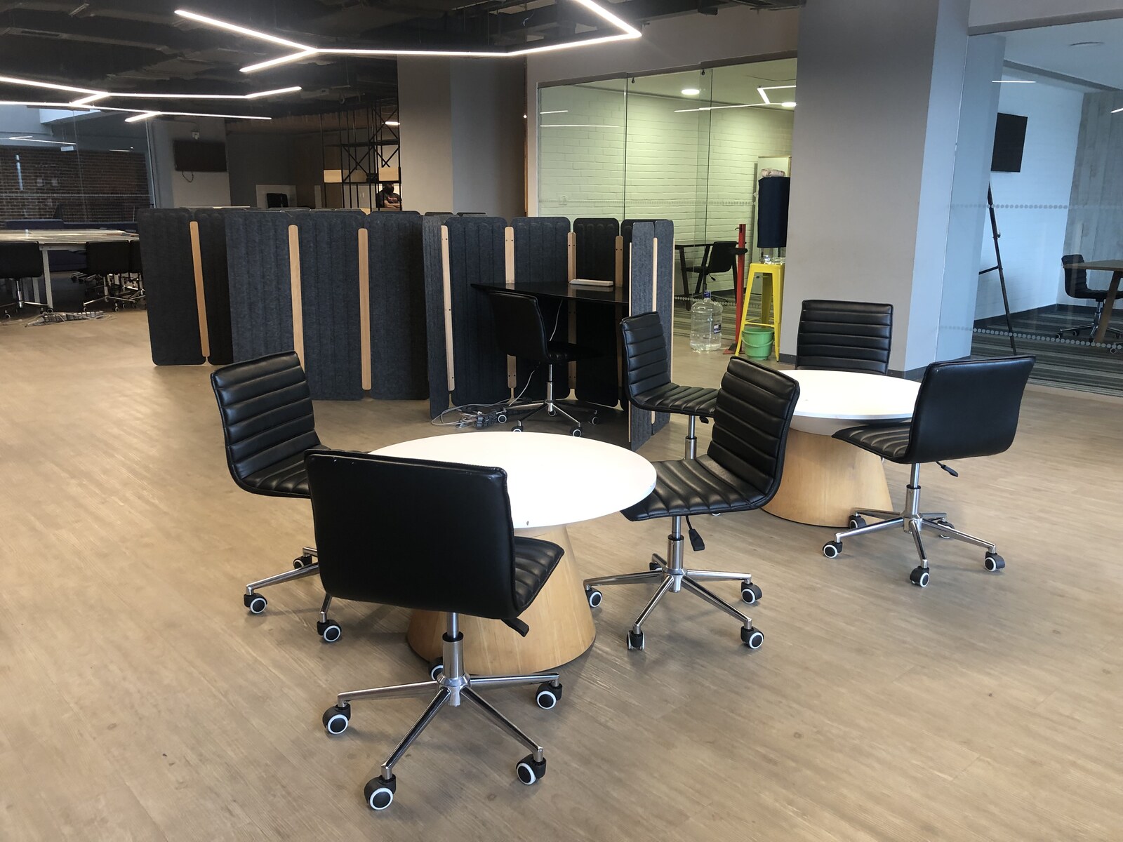 Cospaze Nikoo Homes — collaboration lounge with round tables